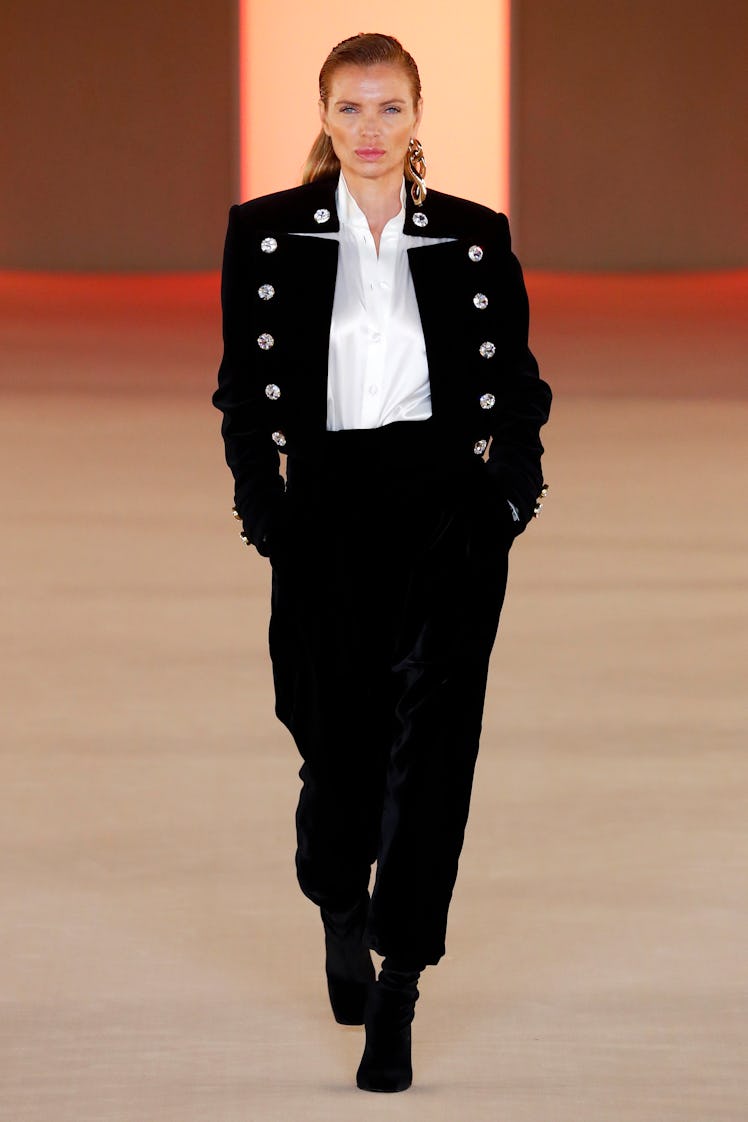 Esther Cañadas wearing a Balmain admiral jacket while walking a runway