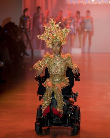 Jillian Mercado walking down the runway in an electric wheelchair because she suffers from muscular ...