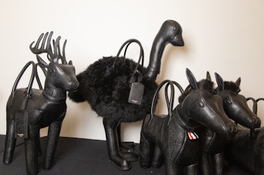 Black leather bags shaped like horses, a reindeer and an ostrich  backstage at the Thom Browne fall ...