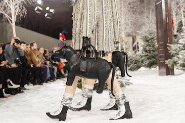 Models on Thom Browne's runway during Paris Fashion Week carrying dog-shaped bags