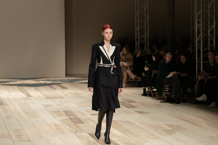 A model in a black-white coat dress at the Alexander McQueen Fall 2020 show