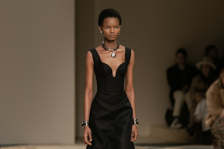 A model in a black dress at the Alexander McQueen Fall 2020 show