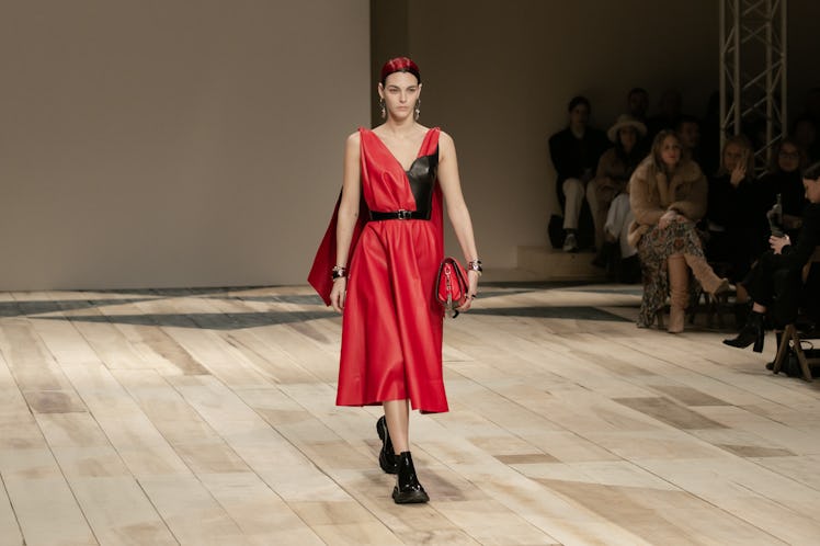 A model in a red-black dress at the Alexander McQueen Fall 2020 show