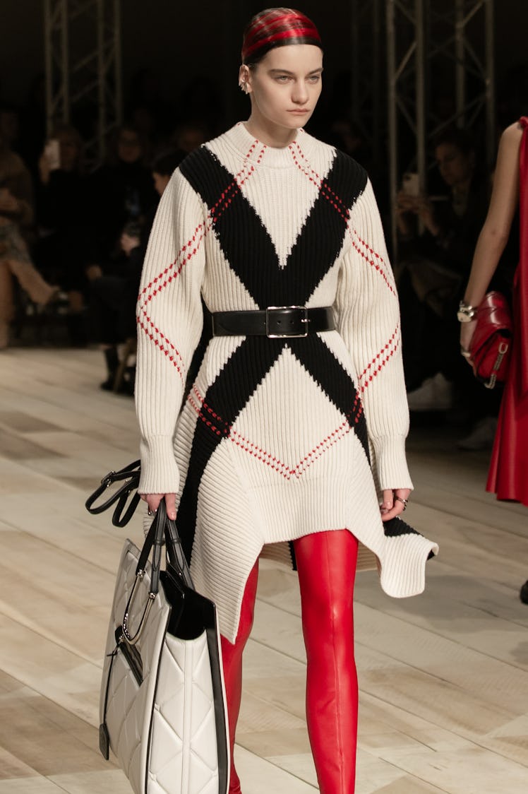 A model in a knit white-black dress at the Alexander McQueen Fall 2020 show