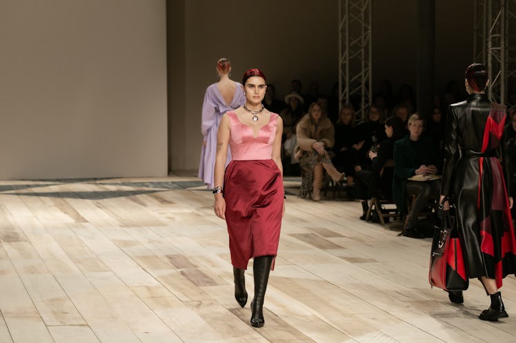 A model in a pink top and red skirt at the Alexander McQueen Fall 2020 show