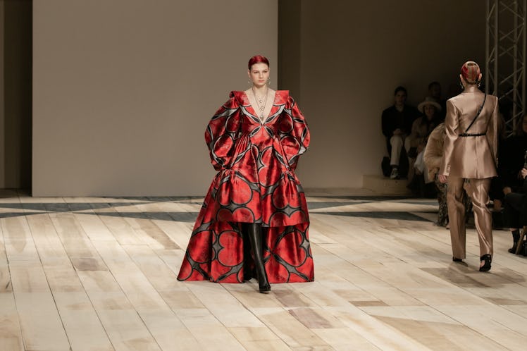 A model in a red-white-black dress at the Alexander McQueen Fall 2020 show