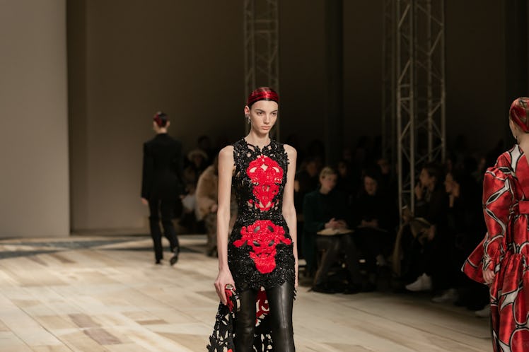 A model in a black-red dress at the Alexander McQueen Fall 2020 show