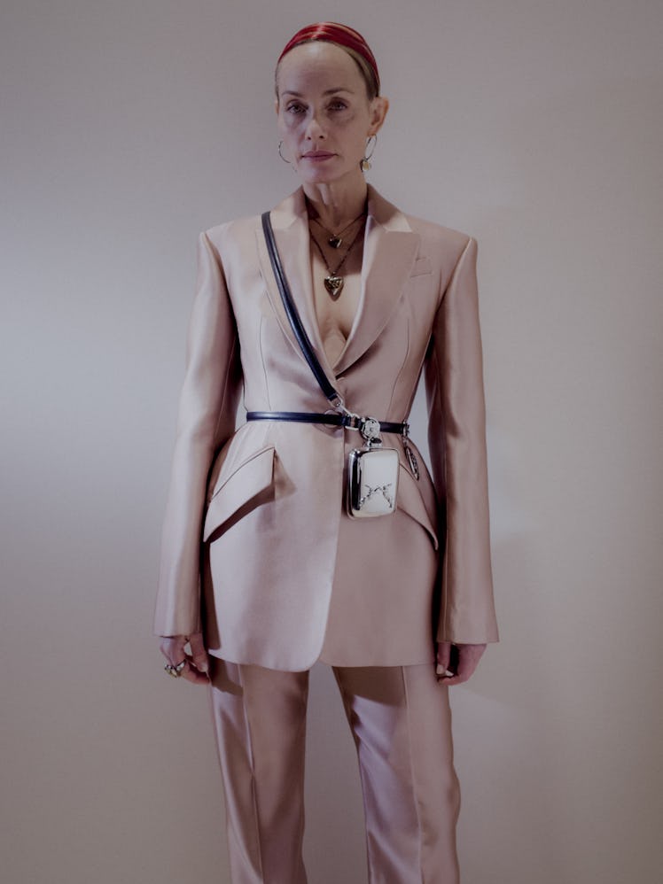 A model in a beige satin suit and black belt at the Alexander McQueen Fall 2020 show