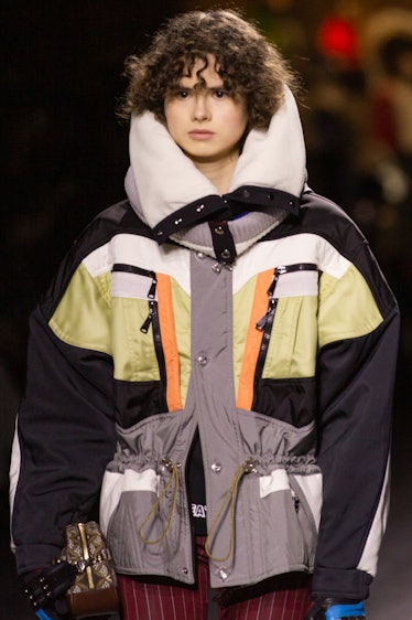 A model in a grey-black-beige jacket at the Louis Vuitton fall 2020 show