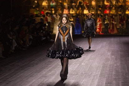 A model wearing a black-brown dress on a Louis Vuitton by Nicolas Ghesquière fashion show