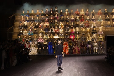 A man standing in front of all the models at the Louis Vuitton fall 2020 show