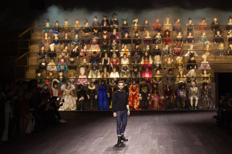 A man standing in front of all the models at the Louis Vuitton fall 2020 show
