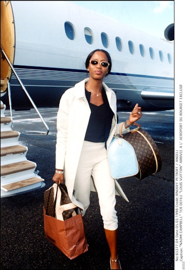 Naomi Campbell With dog and louis vuitton designer luggage at The  Dorchester Hotel London set of 6 Stock Photo - Alamy