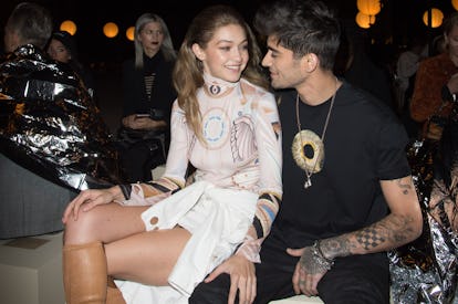 Gigi Hadid and Zayn Malik beaming.