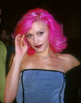 Gwen Stefani posing for a photo while having a pink hairstyle