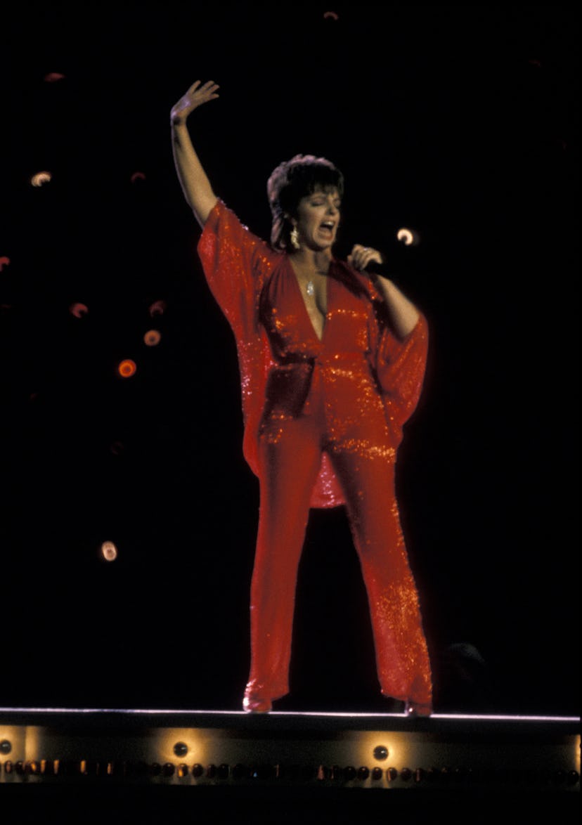 Liza Minnelli in a red jumpsuit.