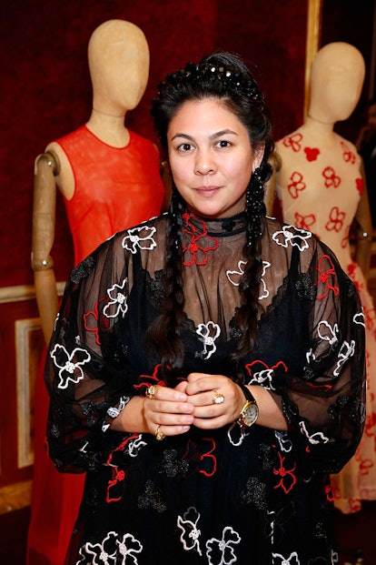 Simone Rocha in a sheer black dress with floral patterns at an event 