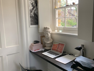 Simone Rocha's desk at home with a laptop, lamp and a white bust 