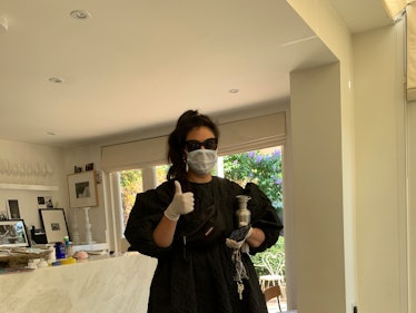 Simone Rocha in a black dress and face mask, delivering scrubs to her team at their homes to support...