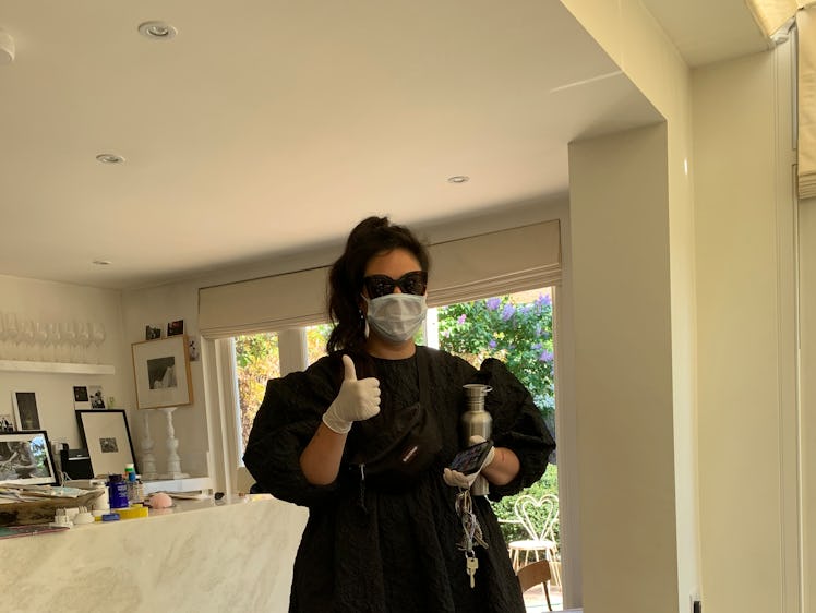 Simone Rocha in a black dress and face mask, delivering scrubs to her team at their homes to support...