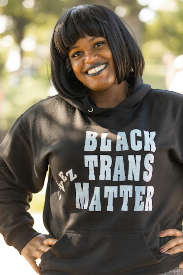 Brooklyn Liberation attendant wearing a black hoody with "Black Trans Livez Matter" text on it
