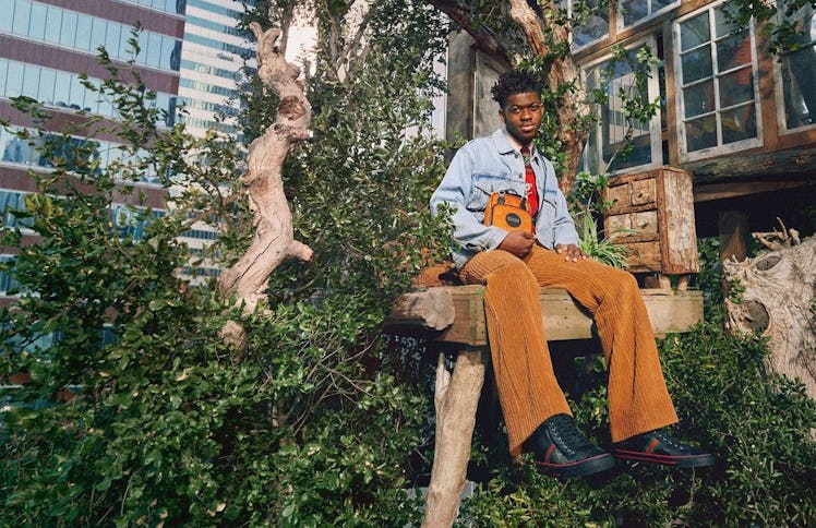 Lil Nas X in a Gucci treehouse.