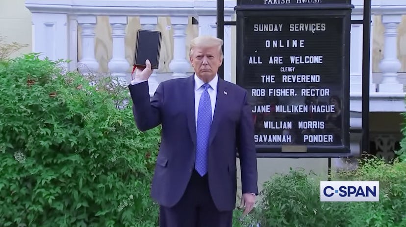 Trump holding a bible