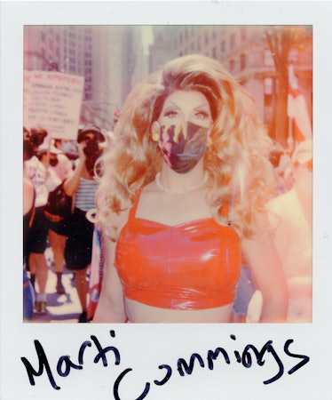 A polaroid shot of a person in a red latex top at the New York City Pride March with the text 'Marty...