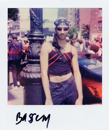 A polaroid shot of a person at the New York City Pride March with the text 'Bassem'