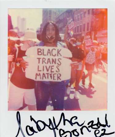 A polaroid shot of a person holding a 'BLACK TRANS LIVES MATTER' poster at the New York City Pride M...