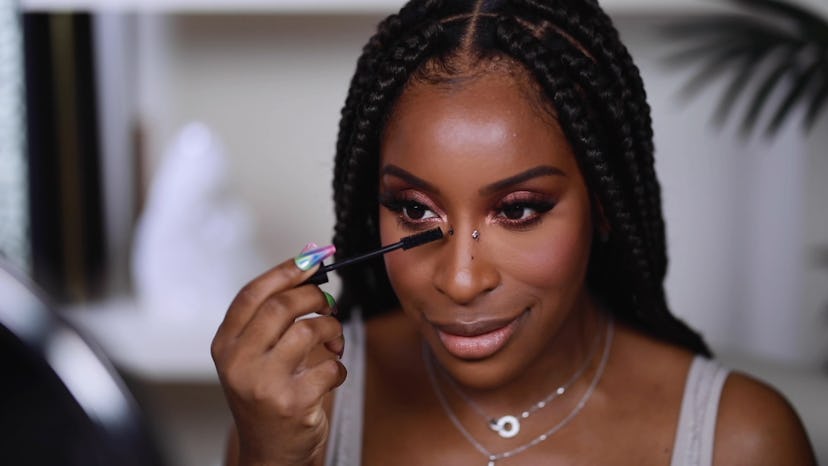 Jackie Aina testing TikTok makeup hacks in her YouTube video