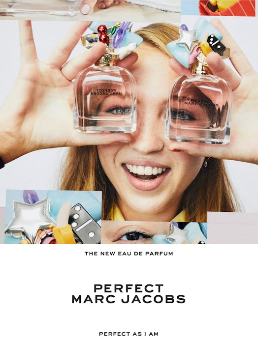 Lila Moss smiling while holding two Marc Jacobs Perfect bottles over her eyes