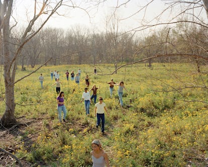 Group of girls walking down a grass field 