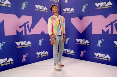 Jaden Smith in a multi-colored jacket, blue denim jeans and white sneakers at the MTV VMAs 2020