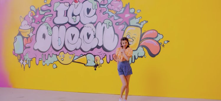 Selena Gomez standing in front of a yellow wall in the “Ice Cream”