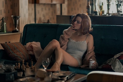 anya taylor-joy smoking on a couch
