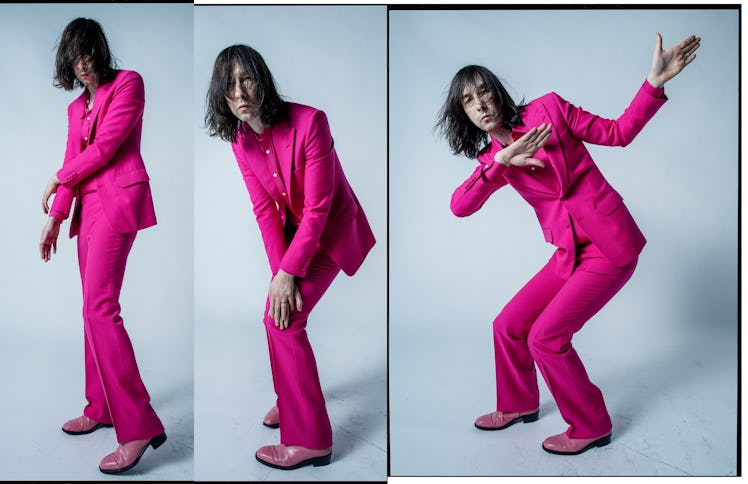 Bobby Gillespie wearing a pink suit