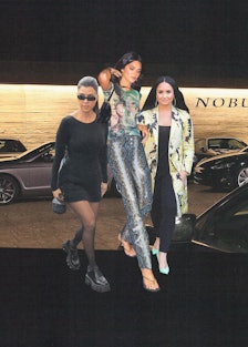 Kourtney Kardashian, Kyle Jenner and Demi Lovato in front of the Nobu Malibu restaurant.