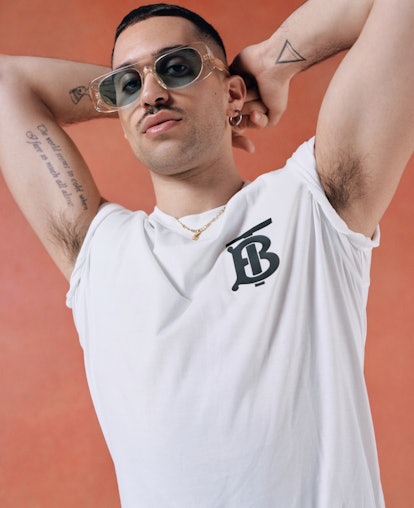 Alessandro Mahmoud posing in a white Burberry t-shirt
