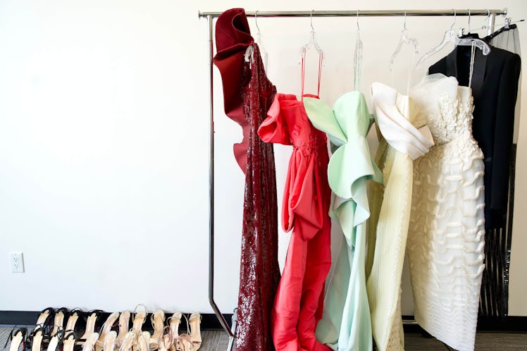 Five Yvonne Orji’s dresses hanged on a bar