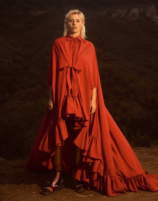 Lauren Wasser posing in a red frilled dress