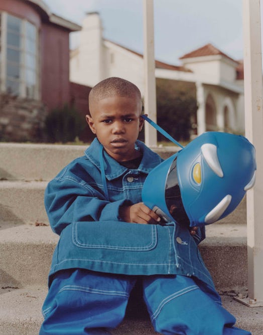 Photograph from Micaiah Carter’s series of a boy in a blue outfit