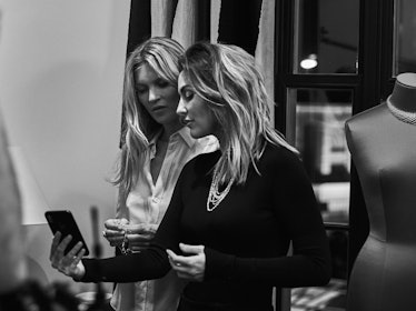 Kate Moss in a black dress and jewelry that was inspired by her travels, and daughter Lila standing ...