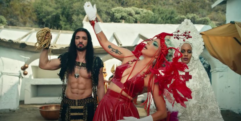 Lady Gaga with man with abs.