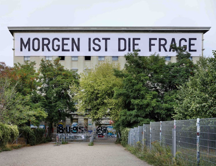 "Morgen ist die frage" big text sign on a white building