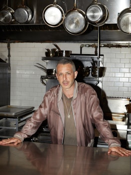 Succession’s Jeremy Strong posing for a photo in a restaurant kitchen