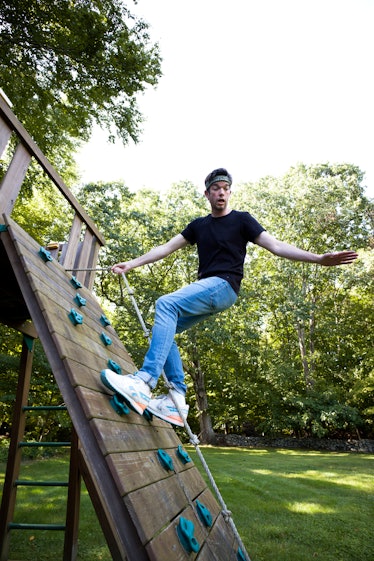 John Mulaney playing in a park