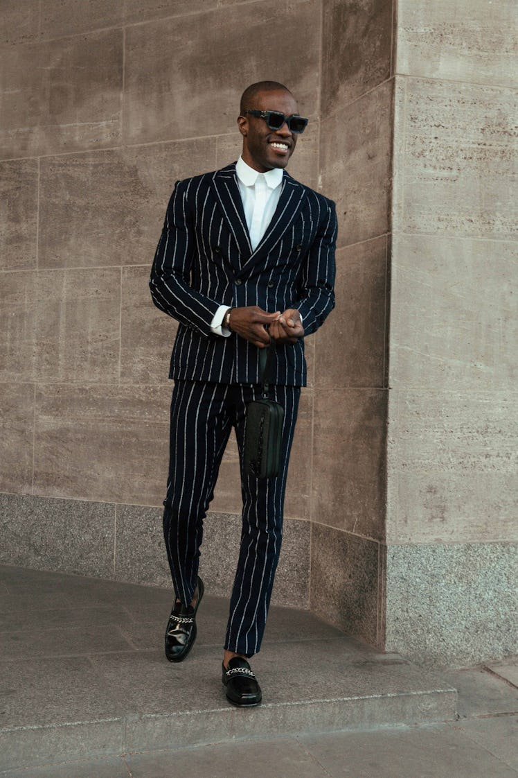 Yahya Abdul-Mateen II in a black white pinstripe suit and a white shirt at the 2020 Emmy Awards