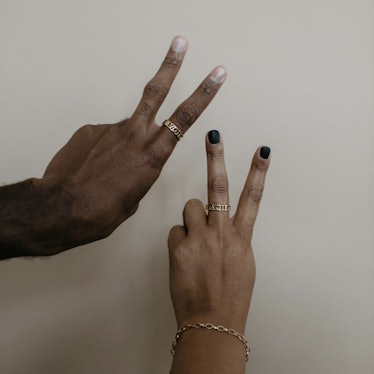 A male and female hand with Stella & Haas Ring