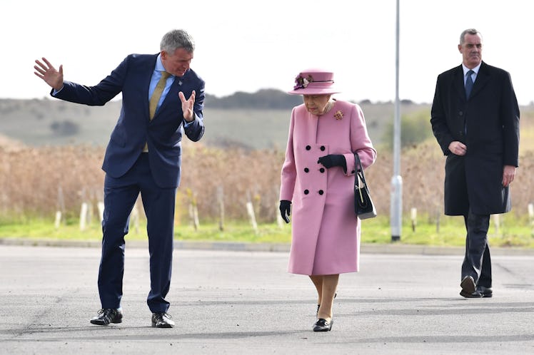 Queen Elizabeth II talking to a man